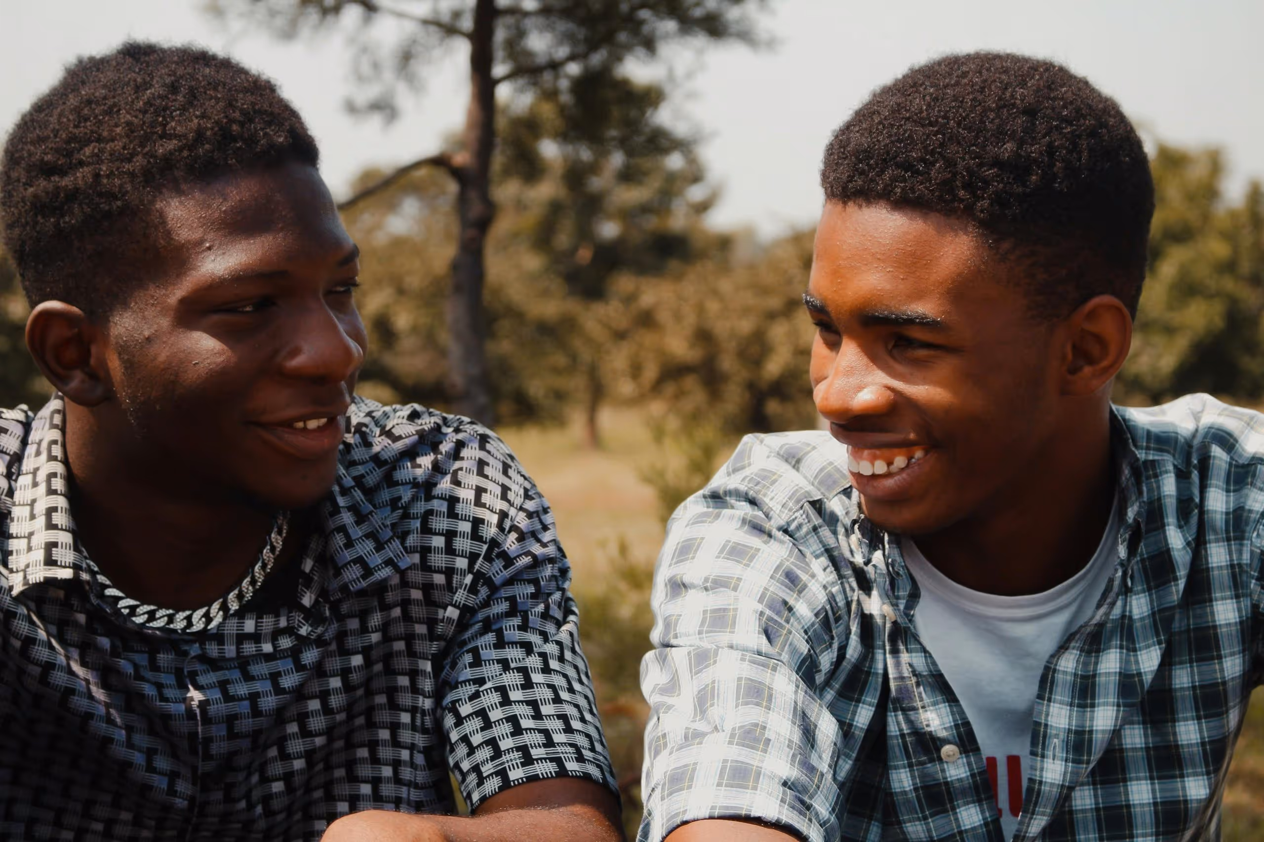 Two young men laughing and smiling together