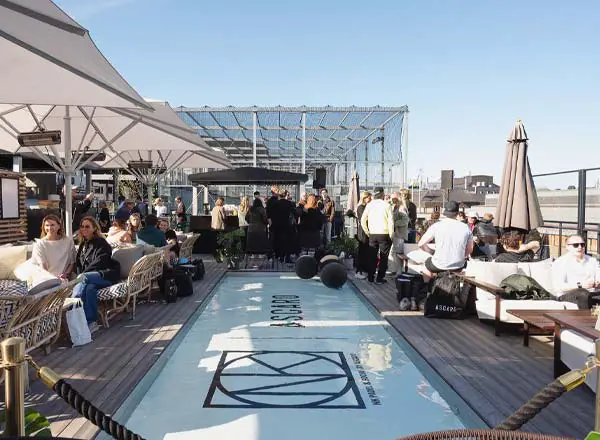 A group of people gathering on the terrace of the conference site.