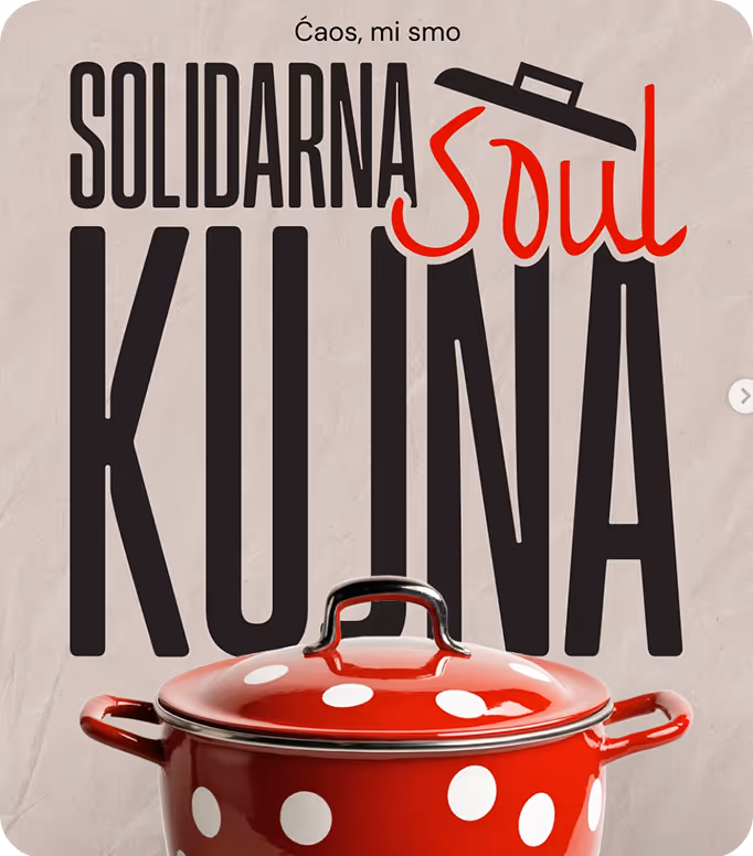 Open menu with a green page listing vitamin juices and prices in Serbian, next to a cartoon black fox wearing red boots holding a glass, on a wooden table with a person's hand nearby.