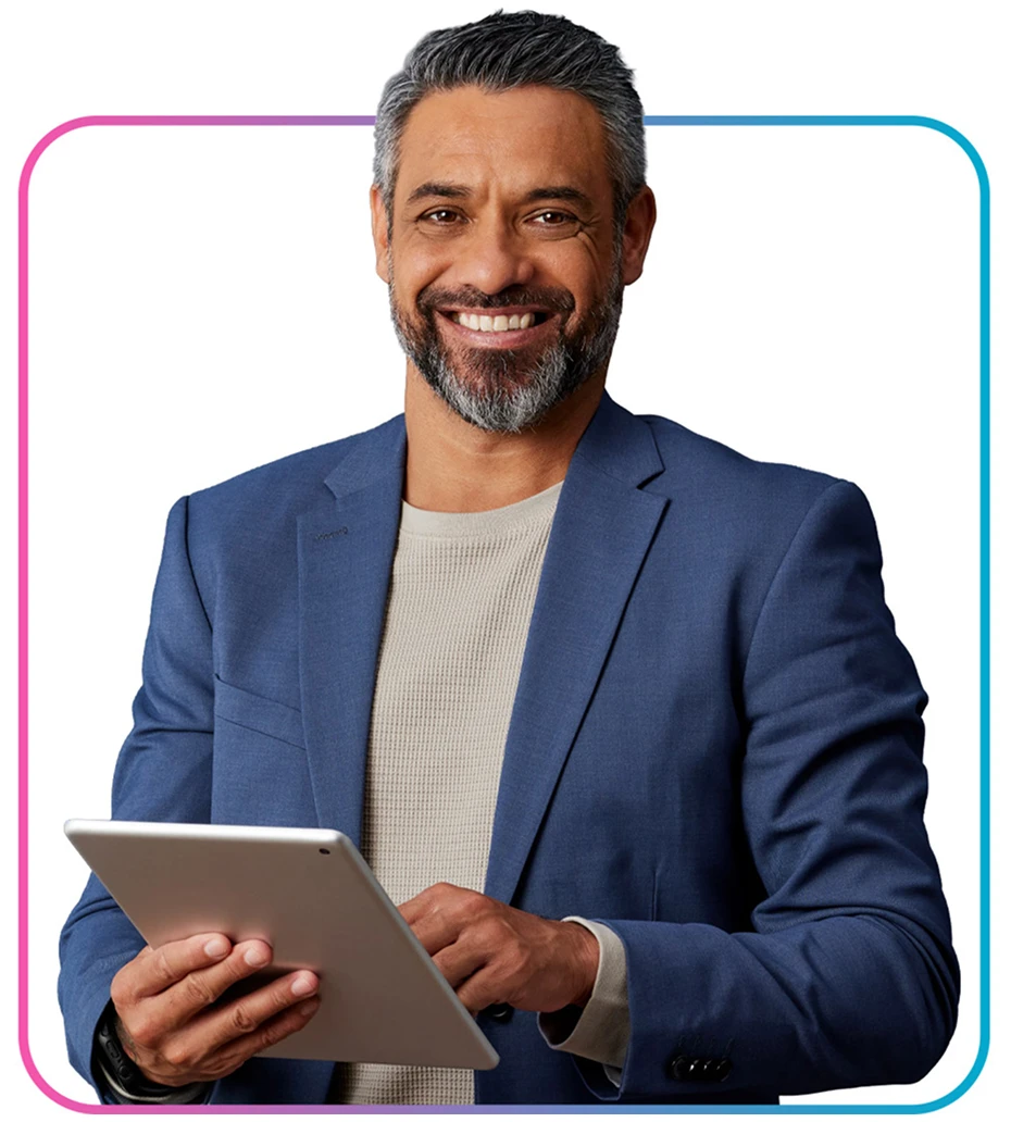 Man holding tablet and smiling