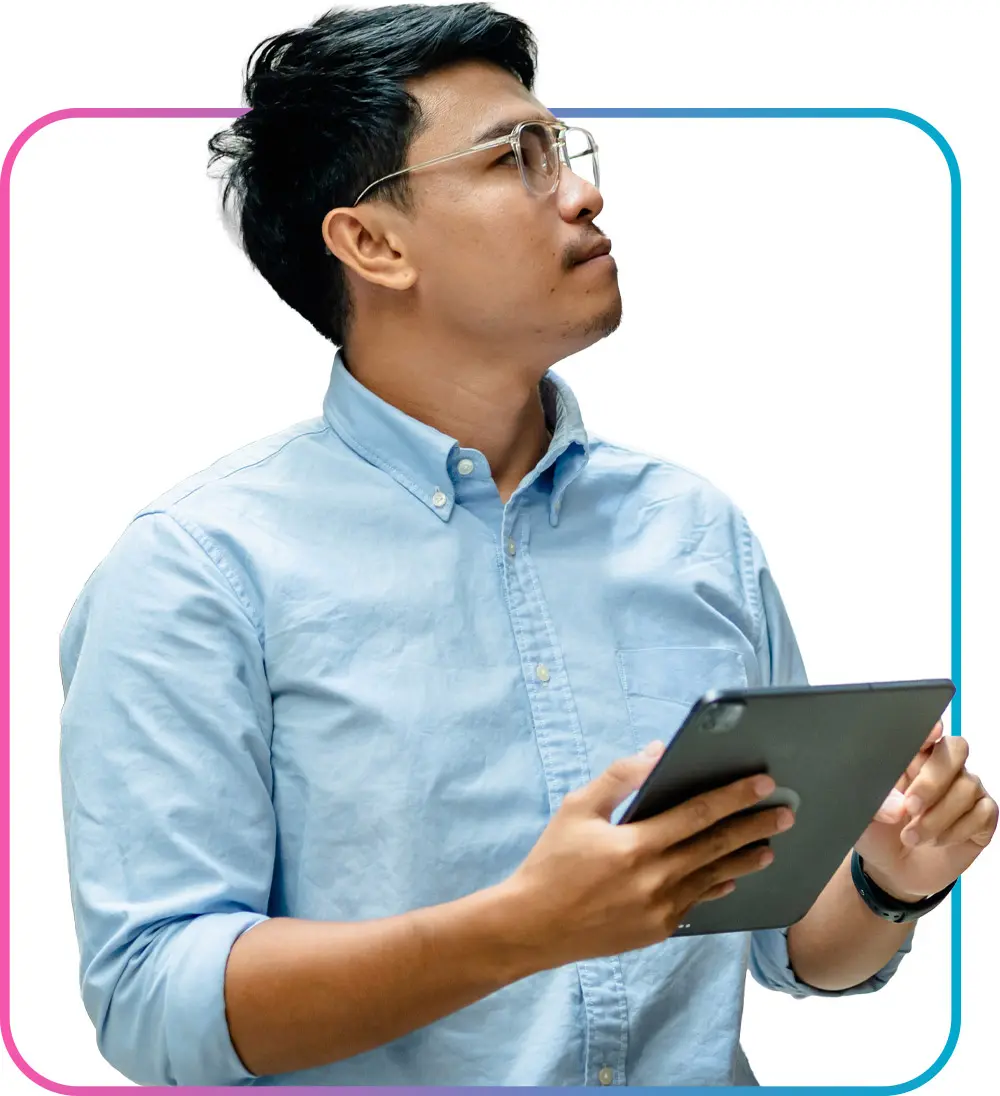 Business professional man holding tablet and looking off to the side
