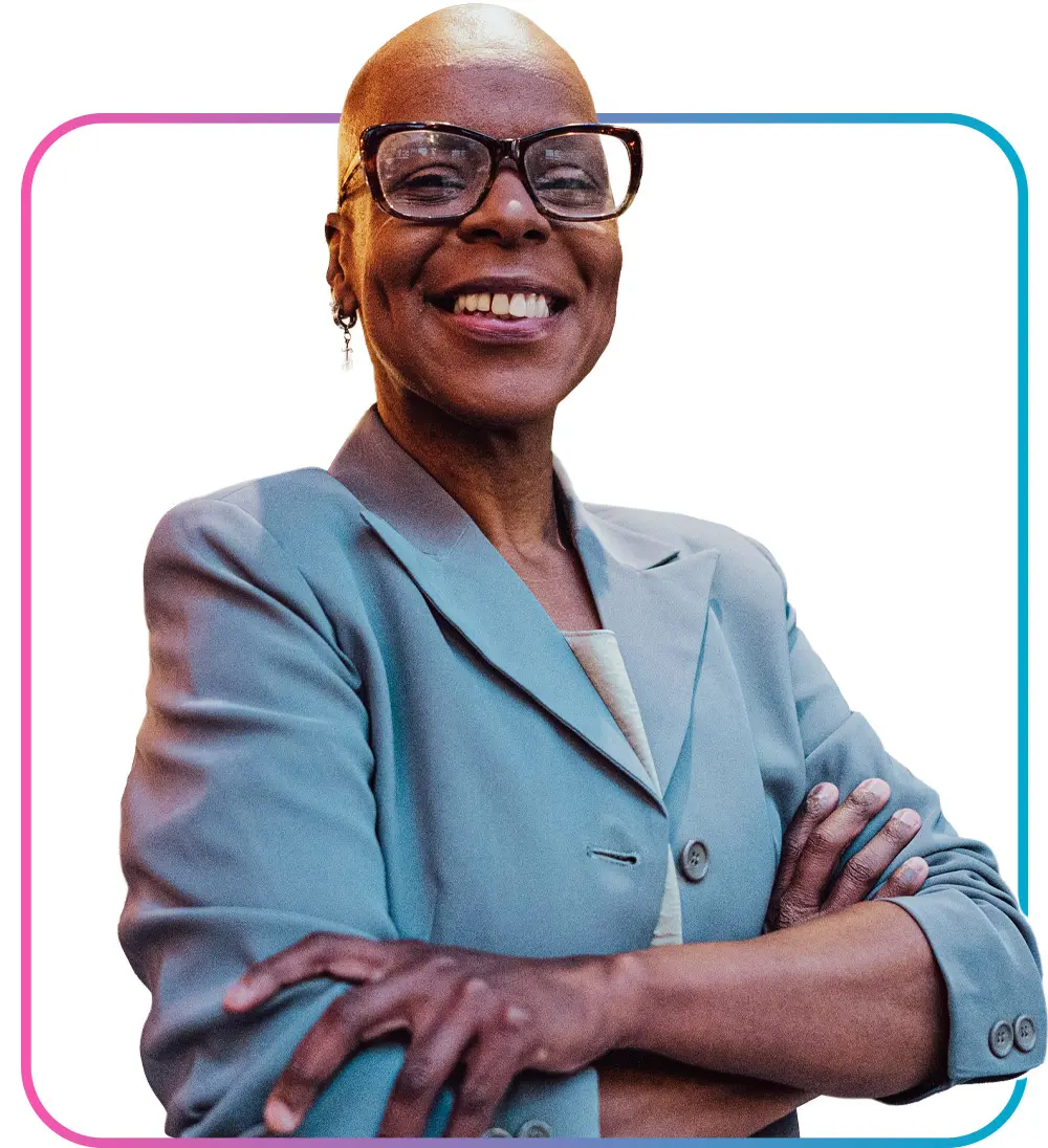 Woman dressed in business professional clothes crossing arms and smiling while tilting body slightly away from camera