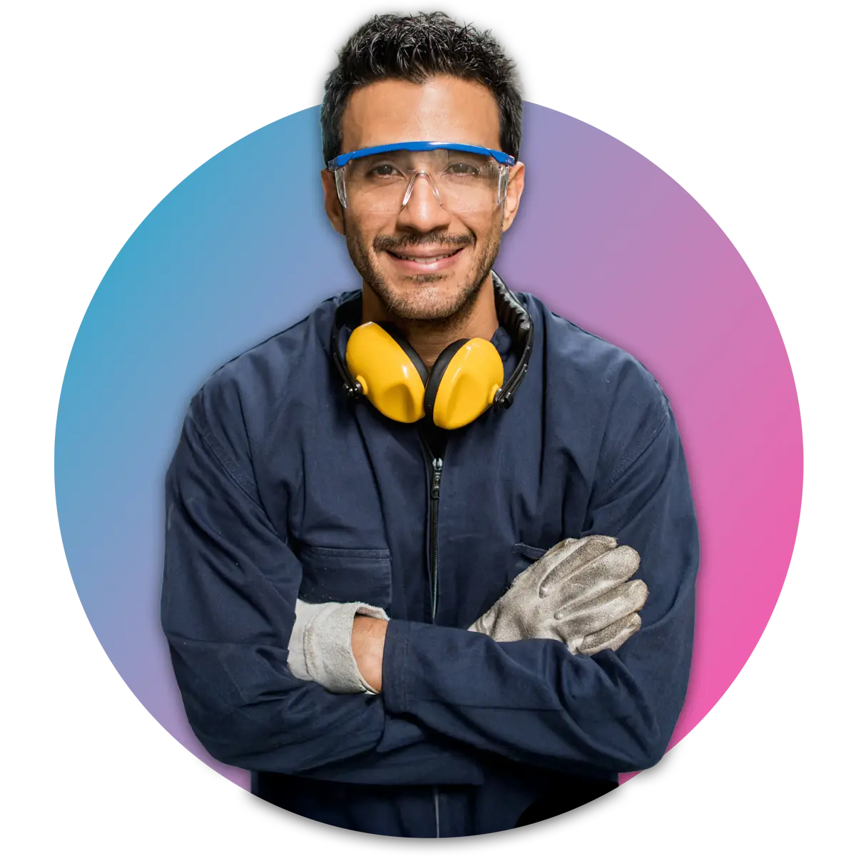 man in safety glasses and gloves with noise protective headphones around neck crossing arms and smiling