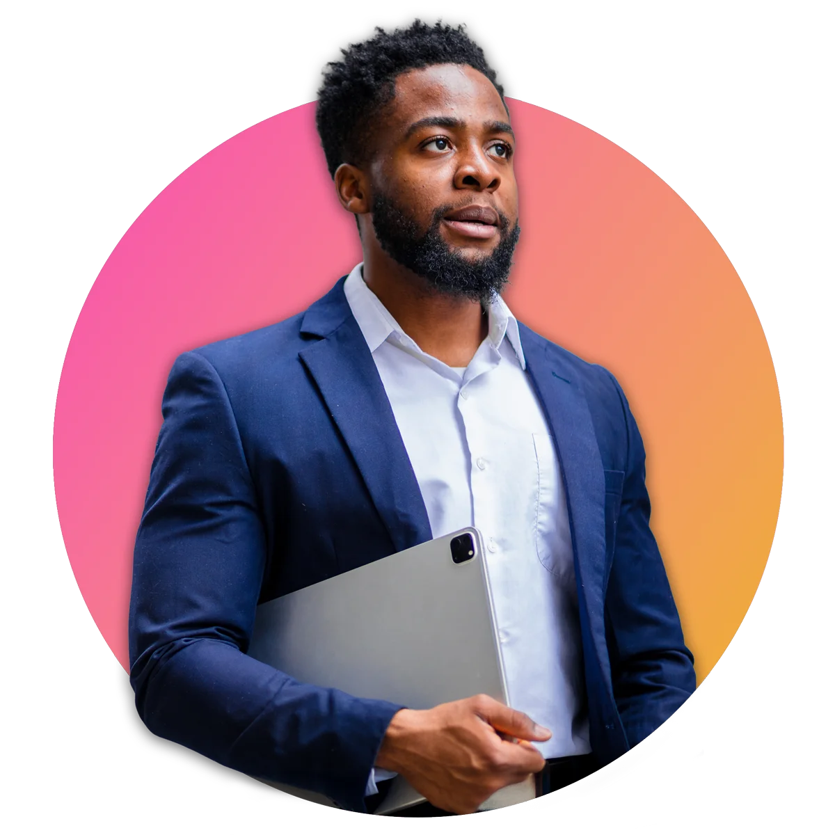 Man in suit holding closed laptop in one arm