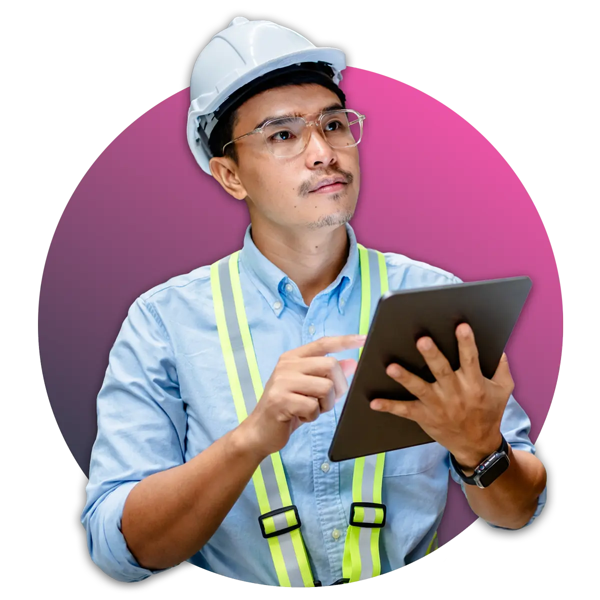 man in hard hat and neon suspenders holding tablet while looking above