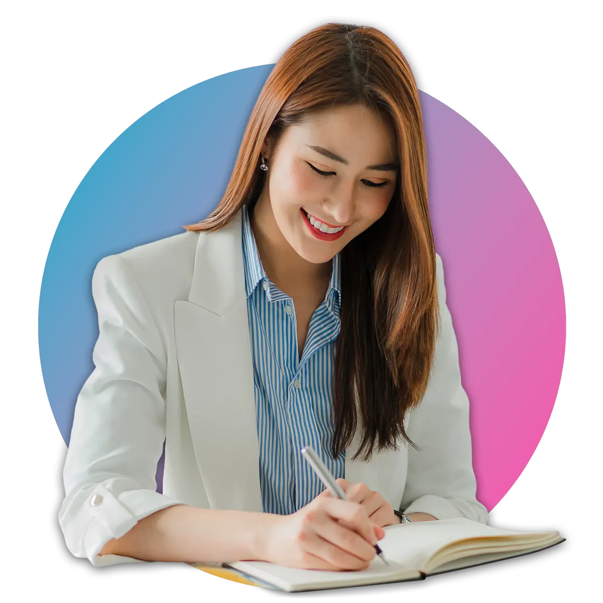 woman in blazer smiling while writing in notebook