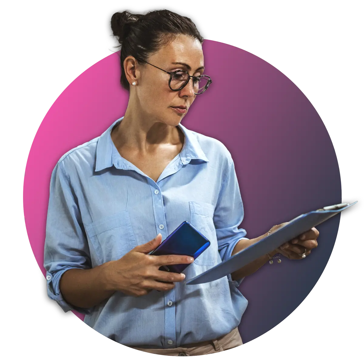 woman in button up shirt holding phone in hand while reviewing papers