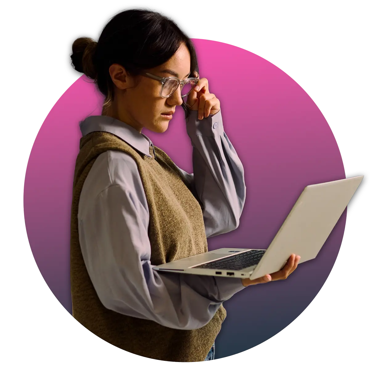 woman holding laptop in one hand while adjusting her glasses with her other hand