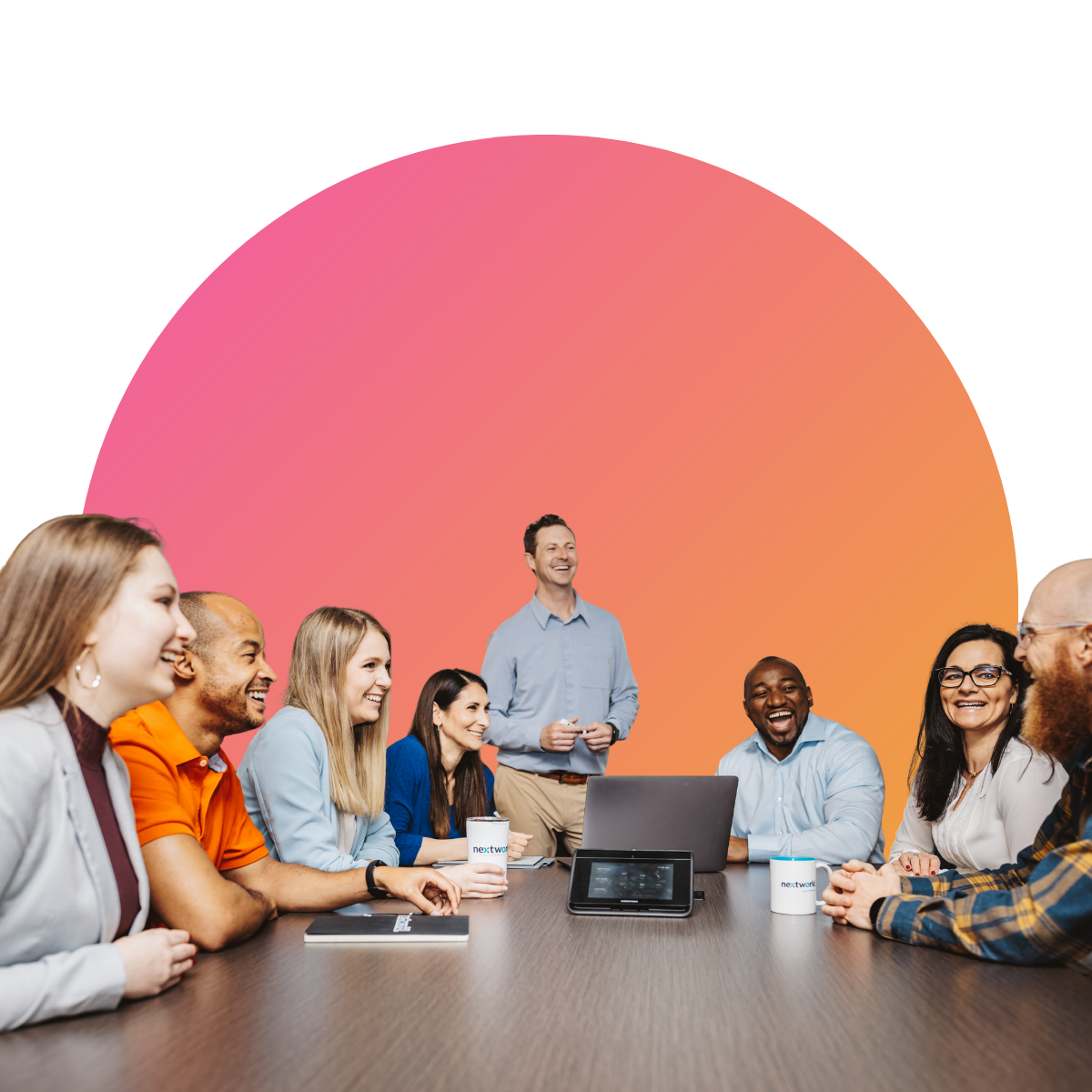 Team members engaged in a discussion at a conference table