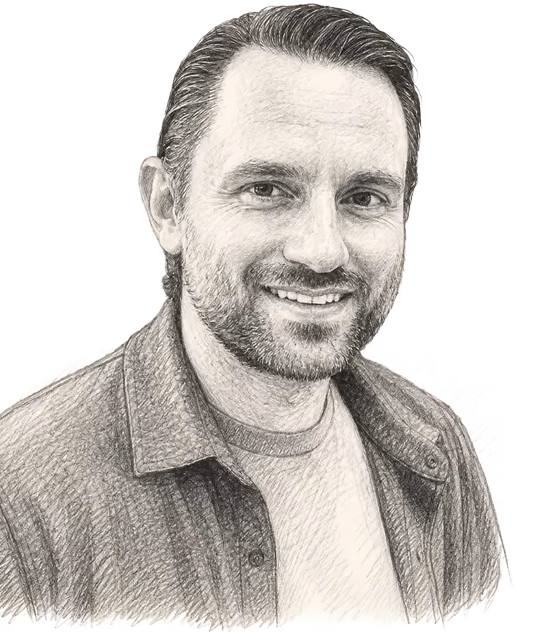 Pencil sketch portrait of a smiling man with short hair and beard wearing a shirt over a t-shirt.