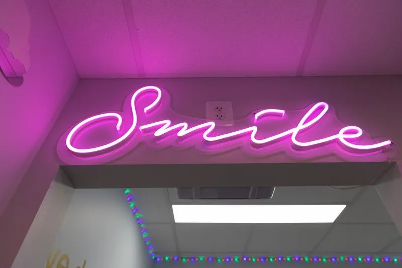 Smile neon sign -  Bethesda Chevy Chase Pediatric Dentistry - Pediatric Dentist in Bethesda MD