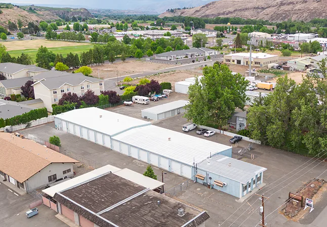 Aerial view of Security 1st Storage, 34th Avenue, showing fenced property, multiple storage buildings, and surrounding neighborhood.