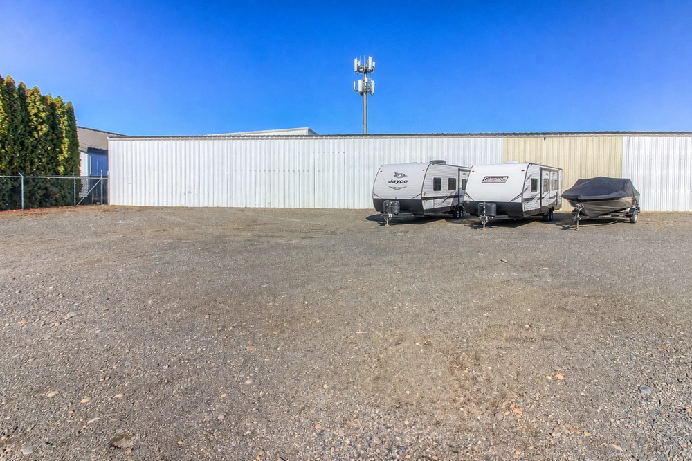 Spacious gravel lot at West Yakima Storage on N 34th Ave, with a fenced perimeter and secure outdoor storage for RVs and boats.