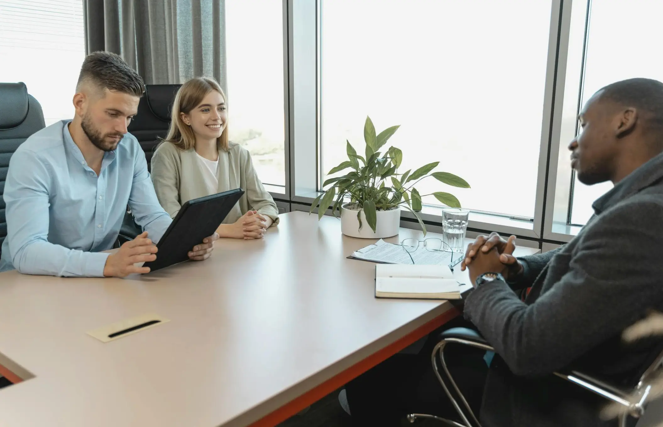 Man Holding a Black Tablet
