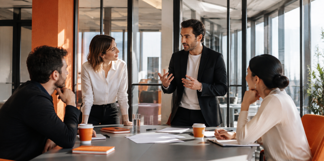 SEO agency team discussing strategy and campaign planning during a meeting in a modern office.