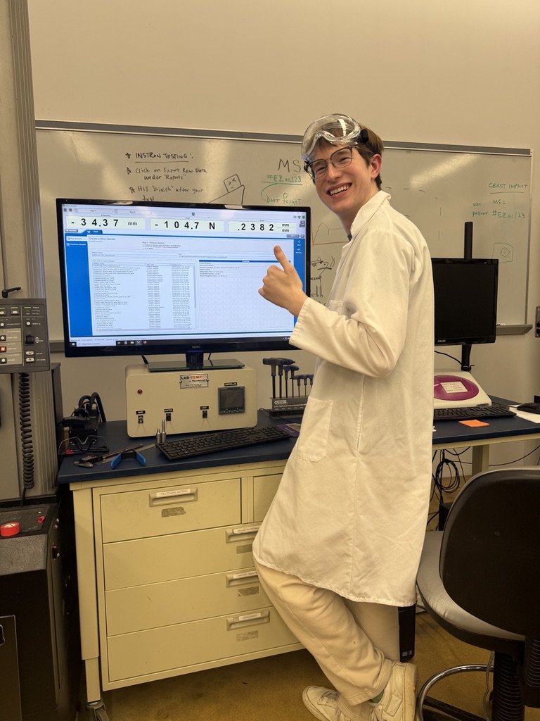 Image of Ryan Thrasher in MIG welding attire looking at the camera and giving a thumbs up