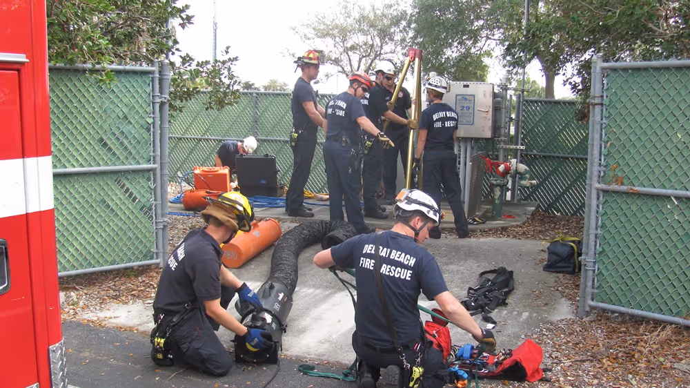Delray Beach Firefighters conduct a technical rescue training drill with safety gear and equipment.