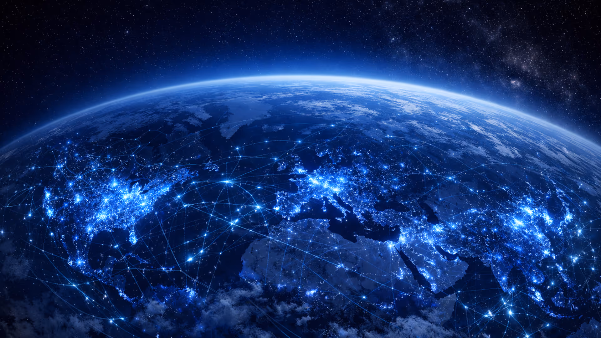 View of Earth from space at night showing illuminated network connections across continents.