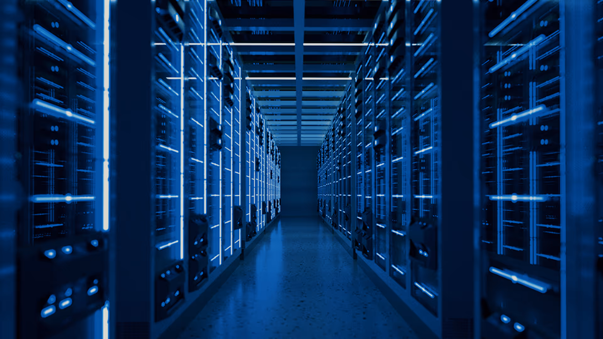 Long corridor in a data center with server racks illuminated by blue LED lights.