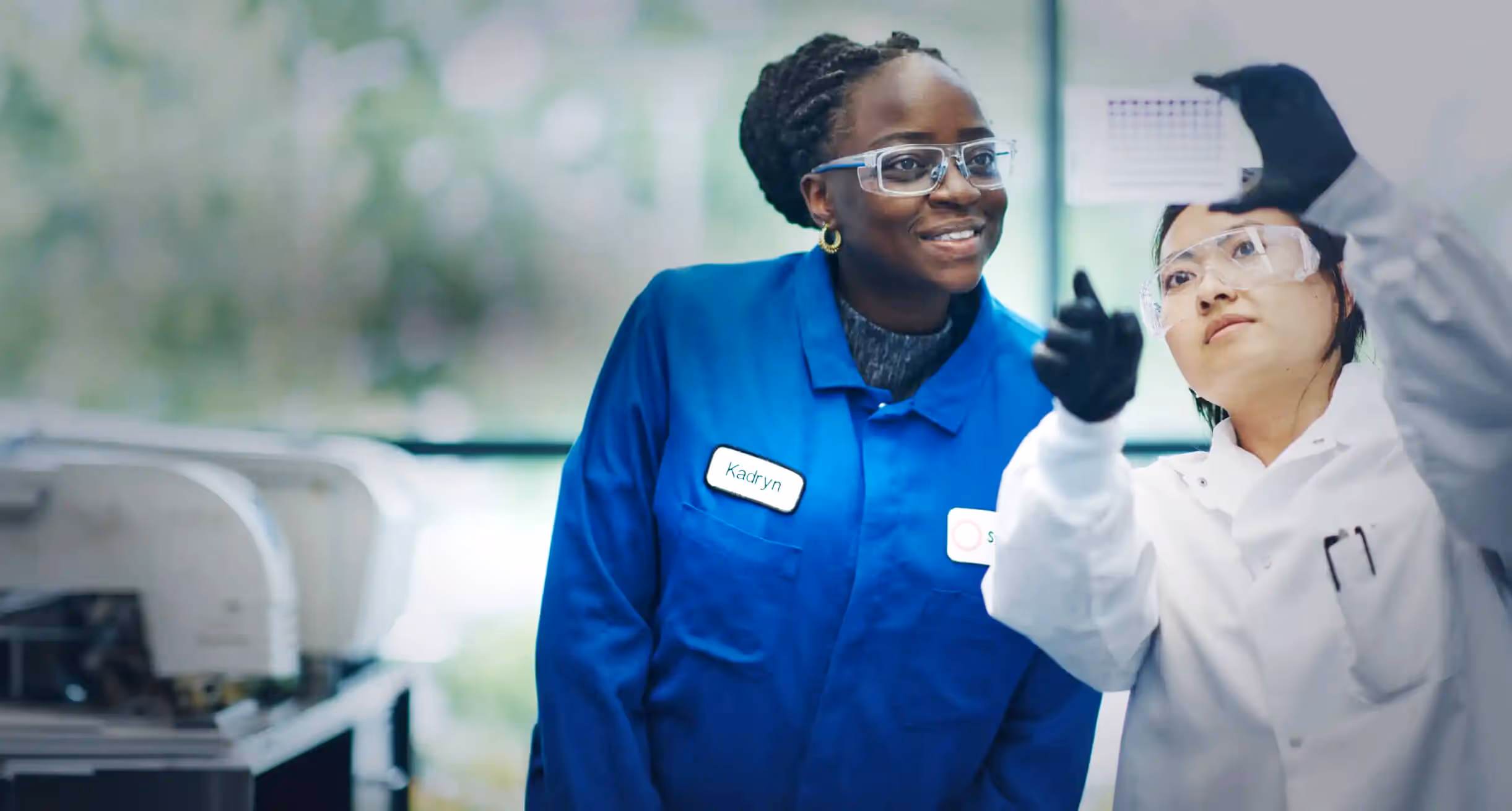 A photograph of two scientists examining an object