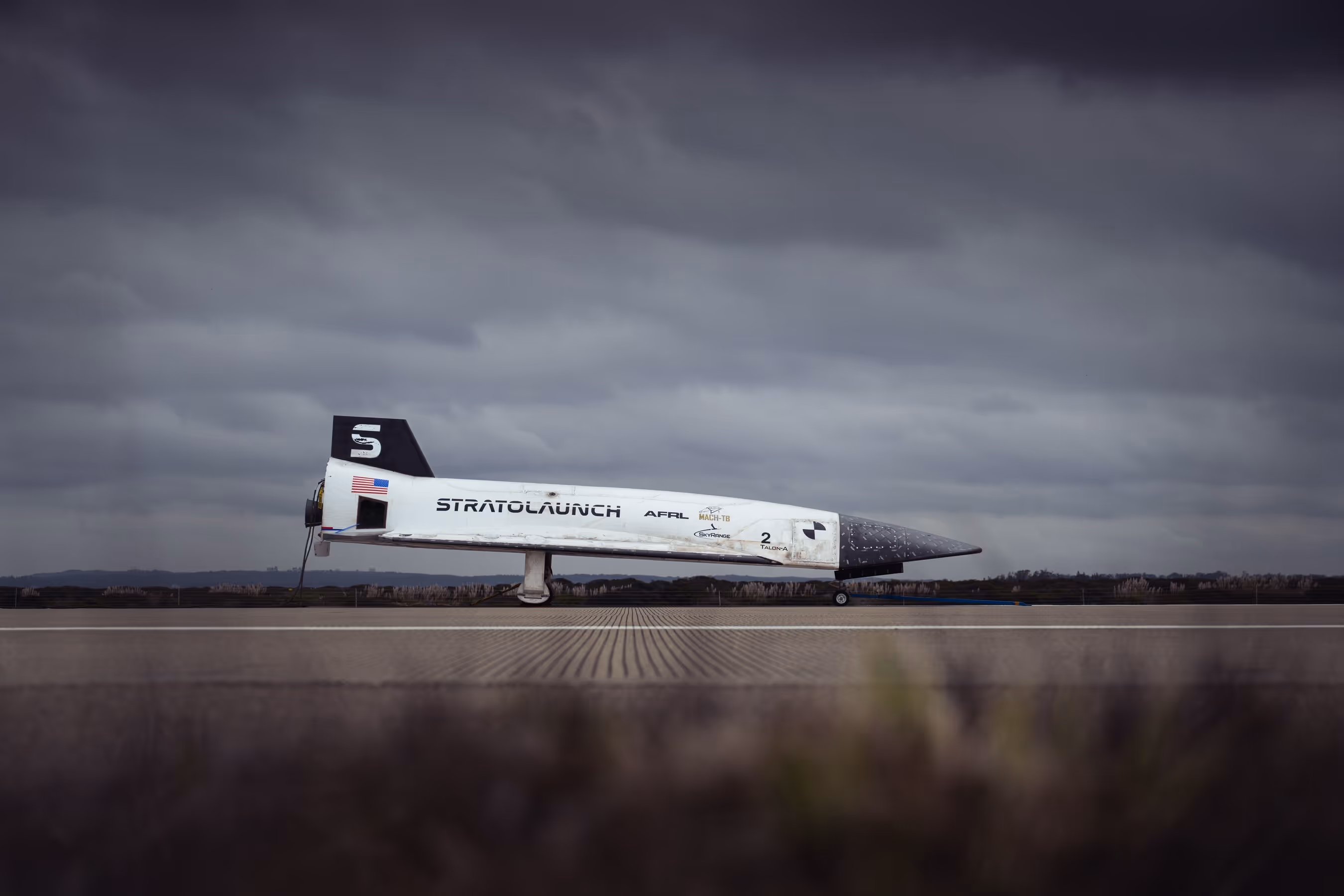 A photograph of a Stratolaunch jet against an overcast background