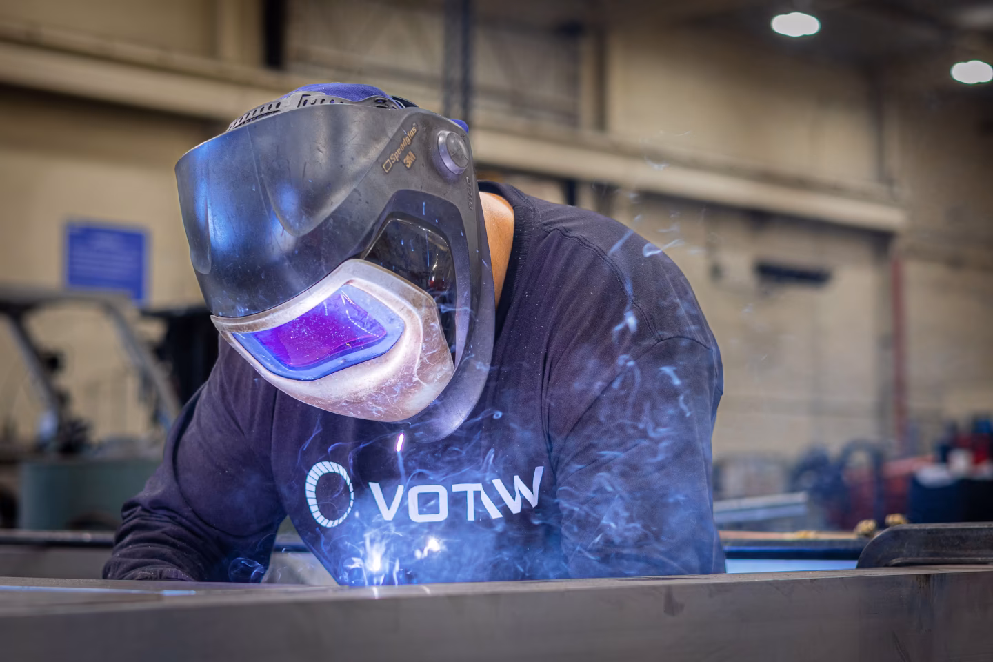 A photograph of someone welding
