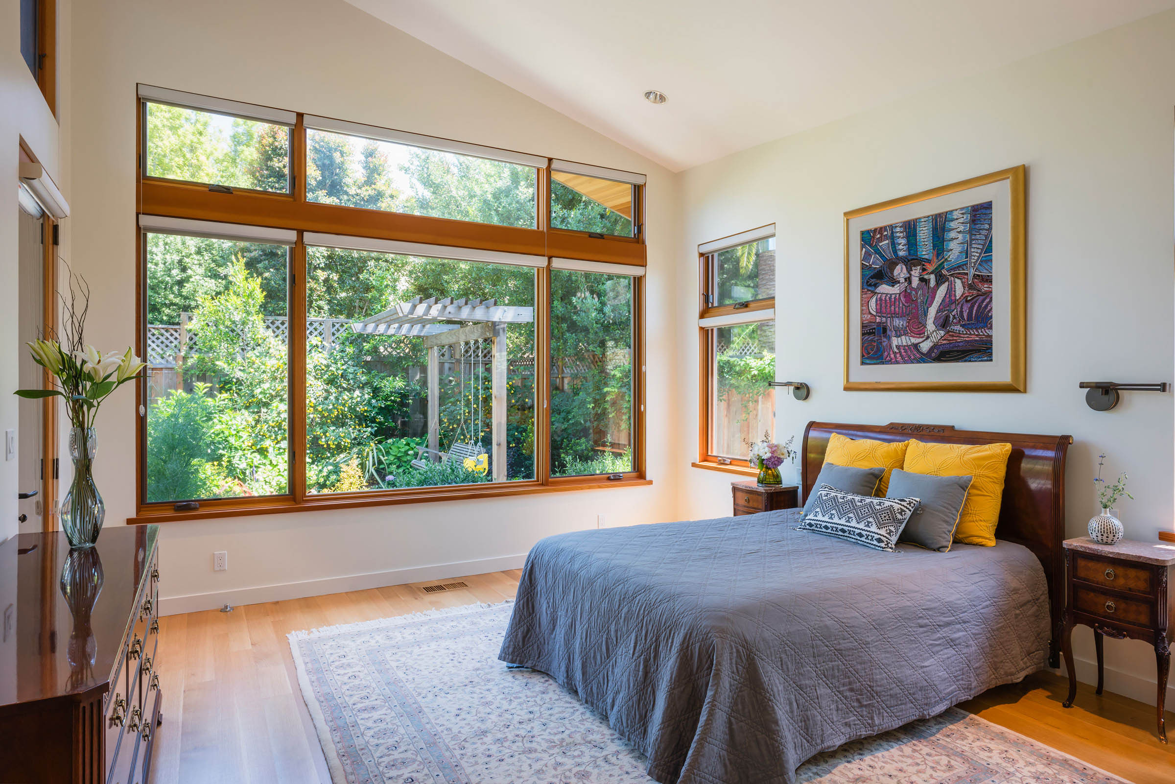 Contemporary master bedroom with high ceiling and garden view in Silicon Valley
