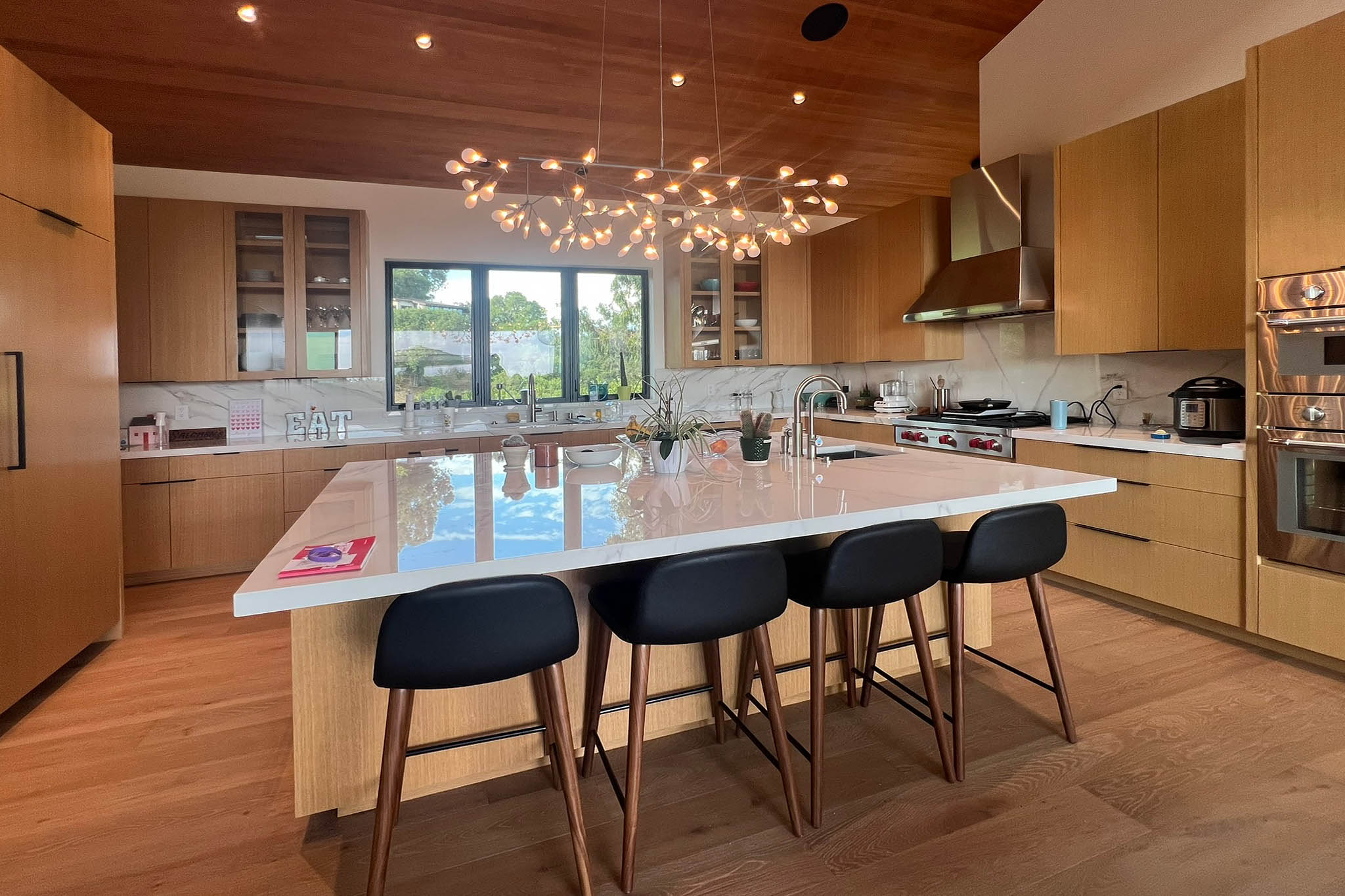 Open modern kitchen with flush cabinets in Los Altos Hills