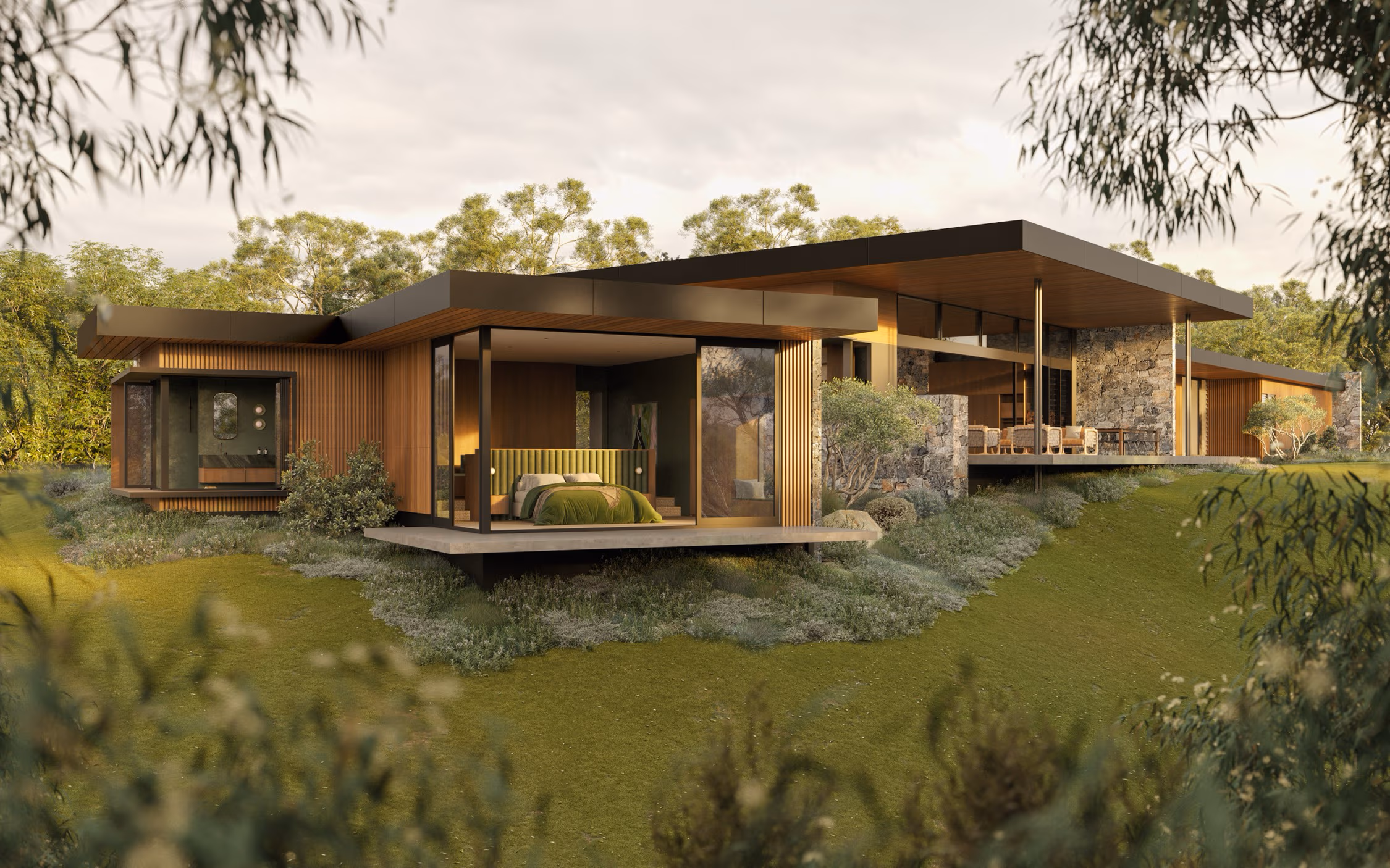 Modern house with large glass windows, wooden paneling, stone walls, and green landscaping, featuring a visible bedroom with a green bedspread.