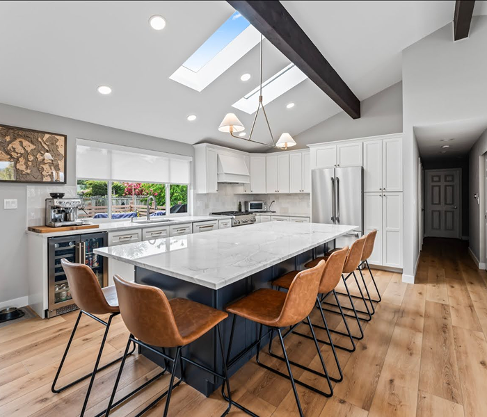 Bright modern kitchen with large island, new flooring