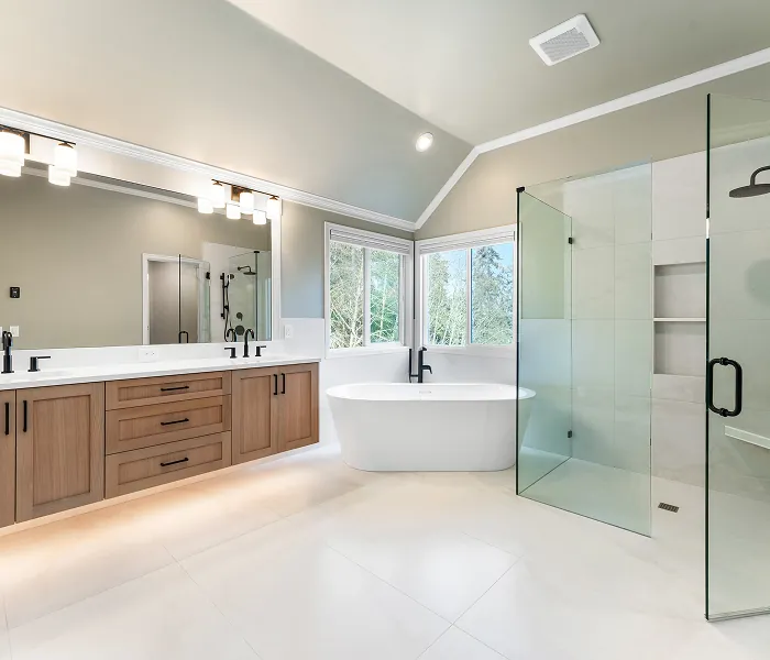 Modern luxury bathroom featuring floating wood vanity