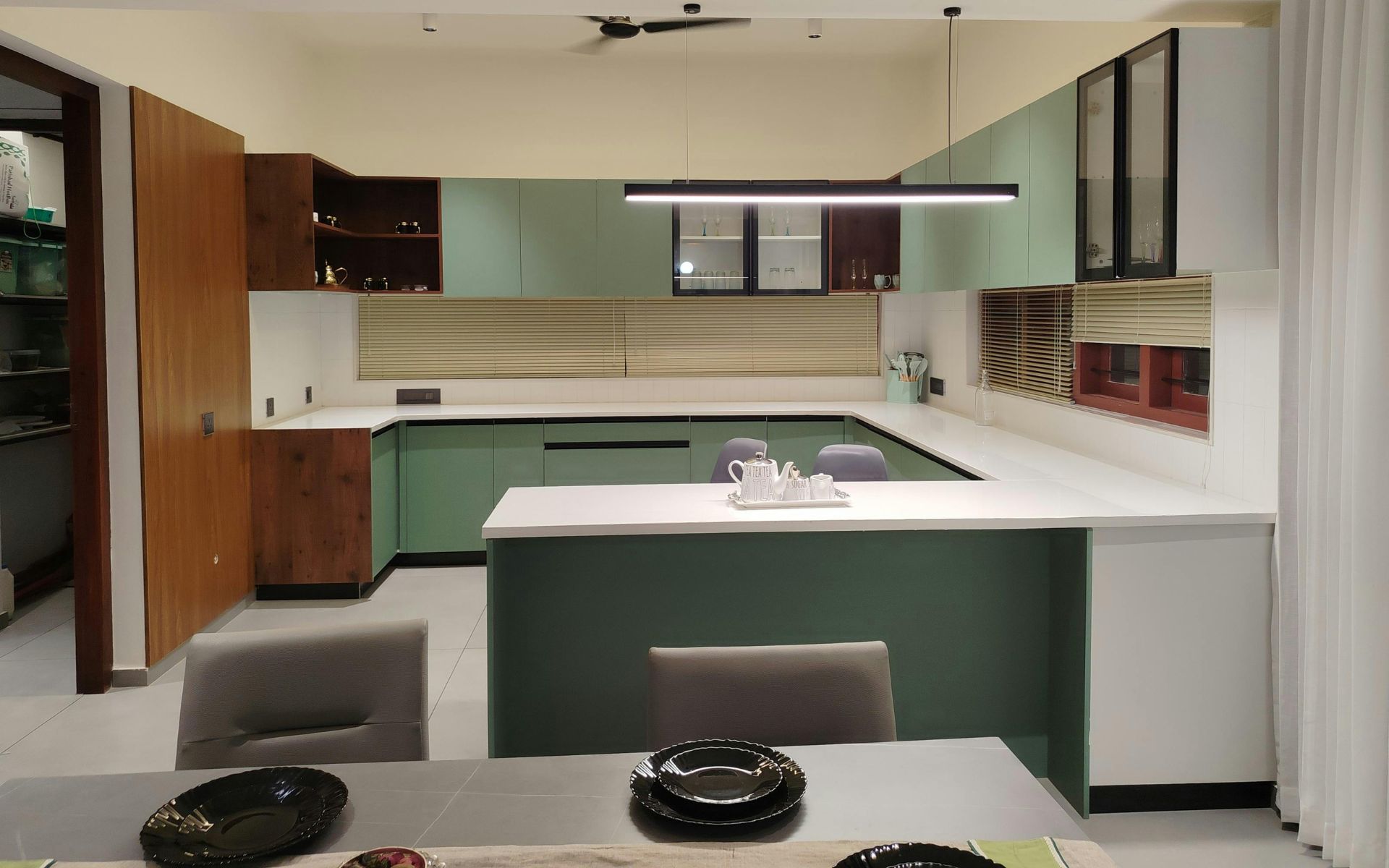 Modern Kitchen Interior with Green Cabinets
