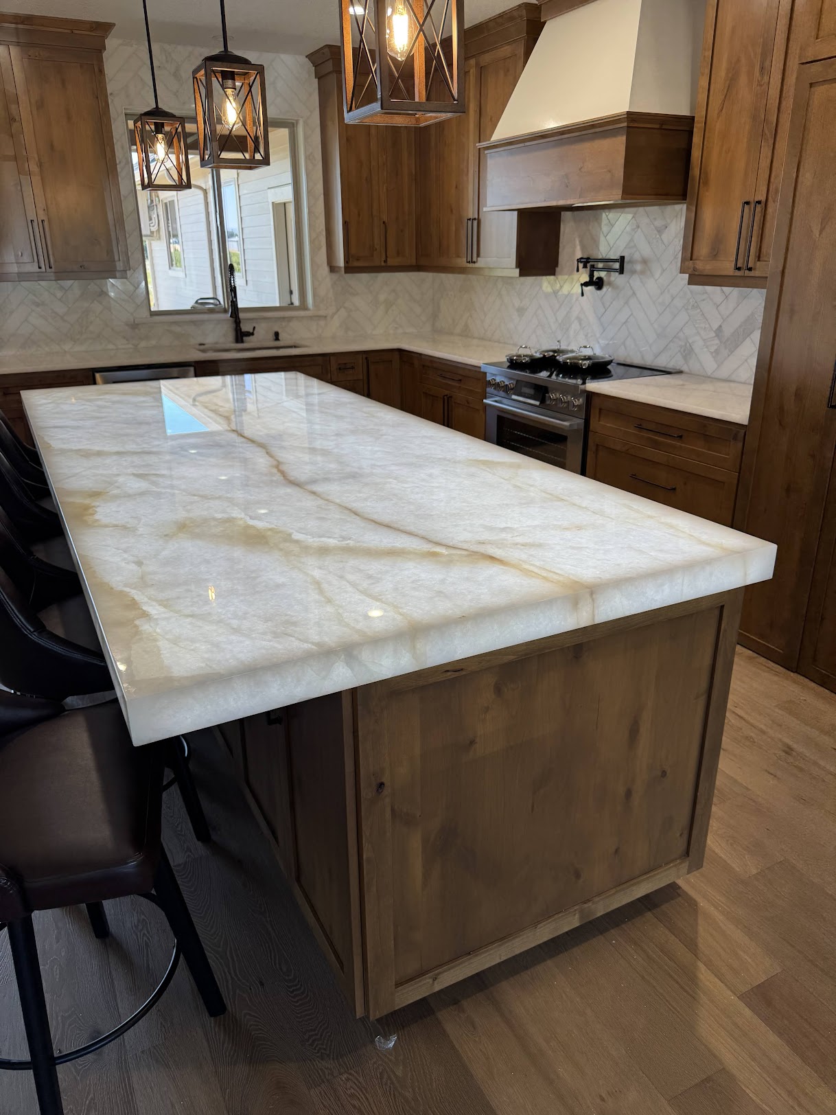 Quartz kitchen countertop with wooden cupboards underneath for storage