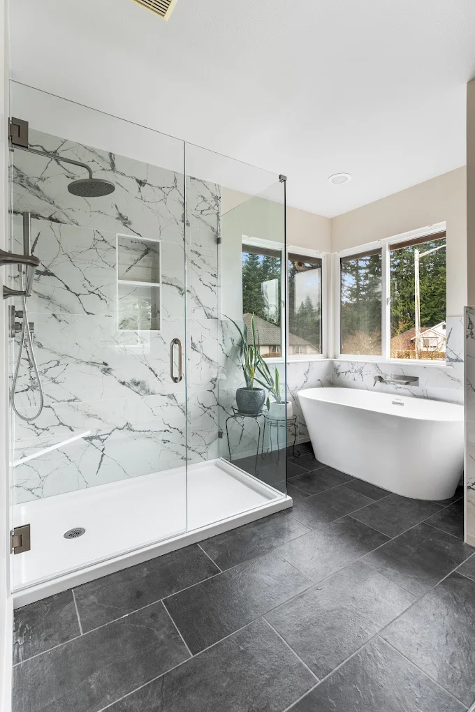 Walk in shower with prefab acrylic pan near a bathtub in Bothell