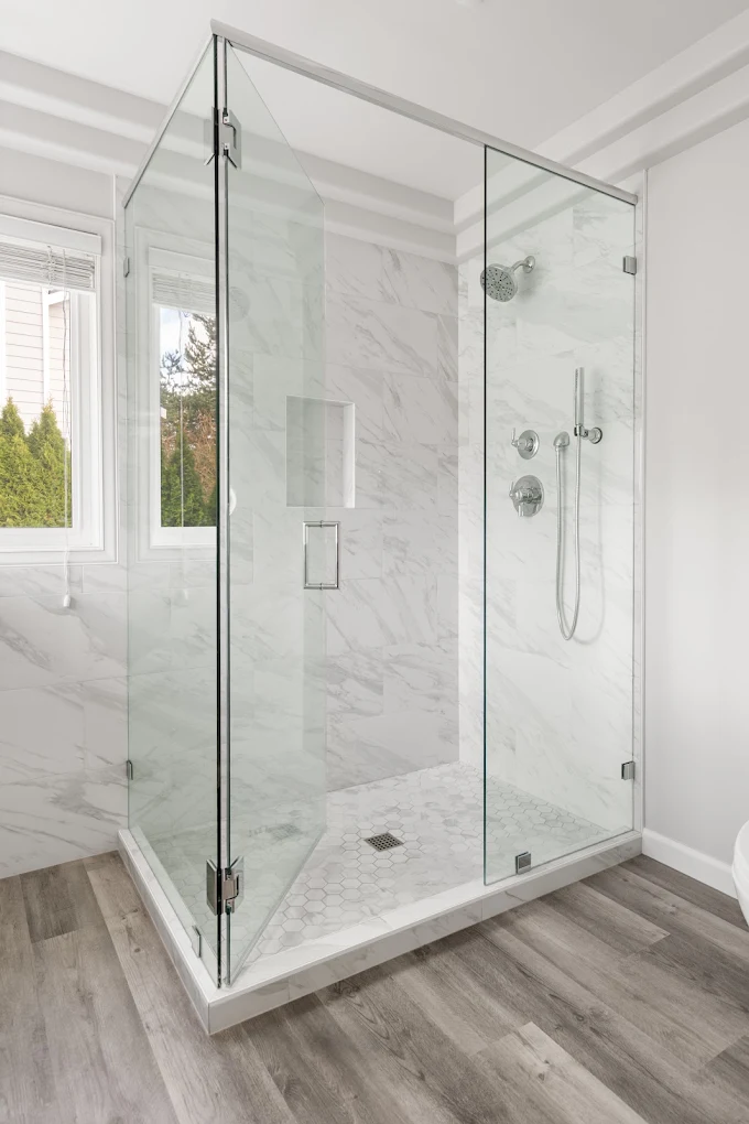 Custom tile walk-in shower with glass door in Bothell 

