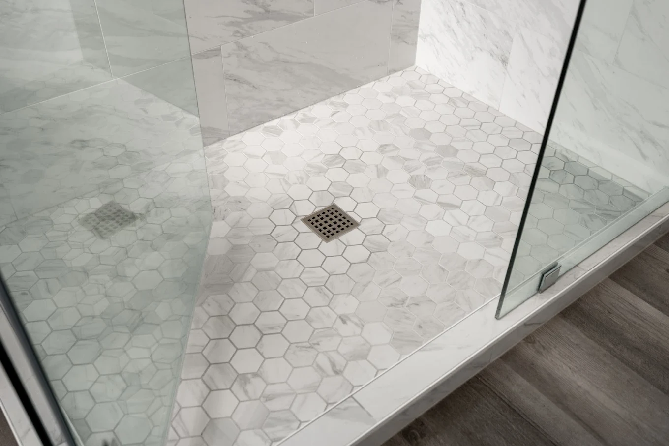 A newly installed tile flooring in a converted shower of a Bothell home