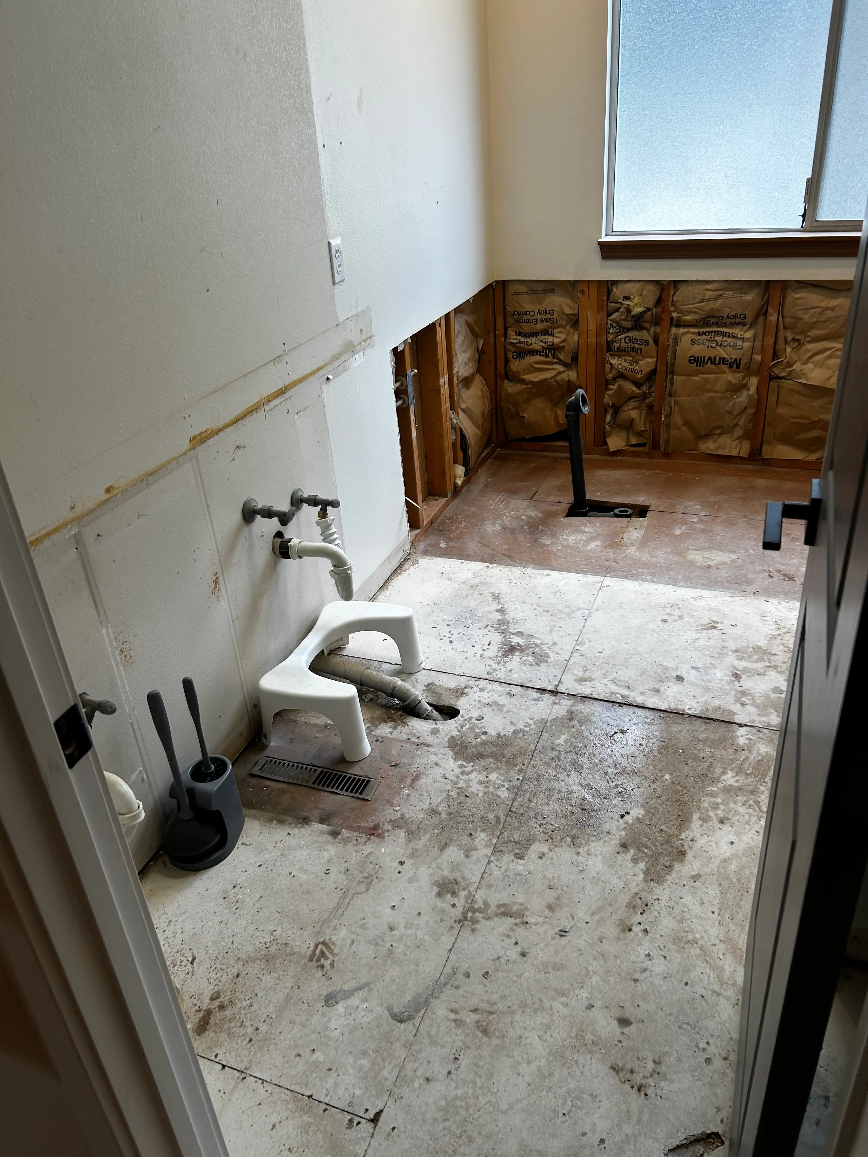 A bathroom in Bothell with shower area being remodeled by CraftHaus