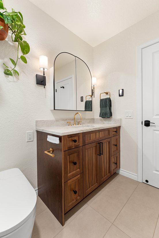 Single-sink bathroom vanity with a stone top installed in a Bothell bathroom