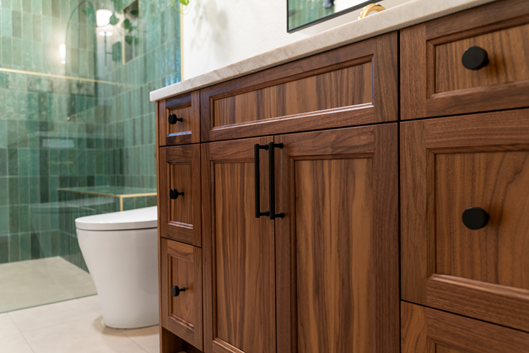 Newly refaced bathroom cabinet in Bothell installed near a toilet bowl
