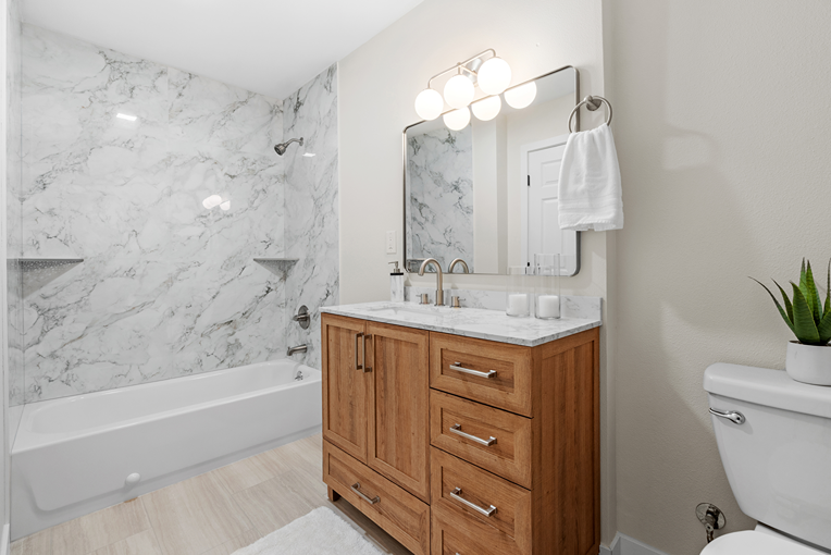 Furniture-style bathroom cabinet with marble top installed in a Bothell bathroom
