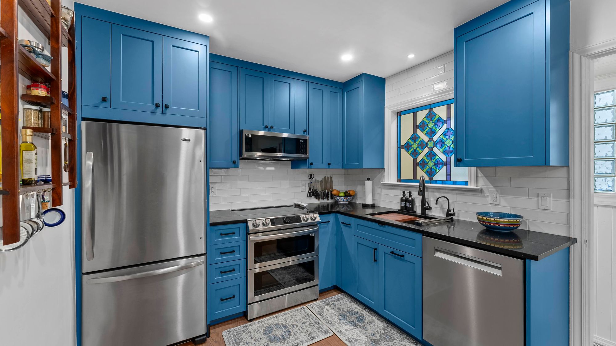 A fully refurbished kitchen with blue cupboards