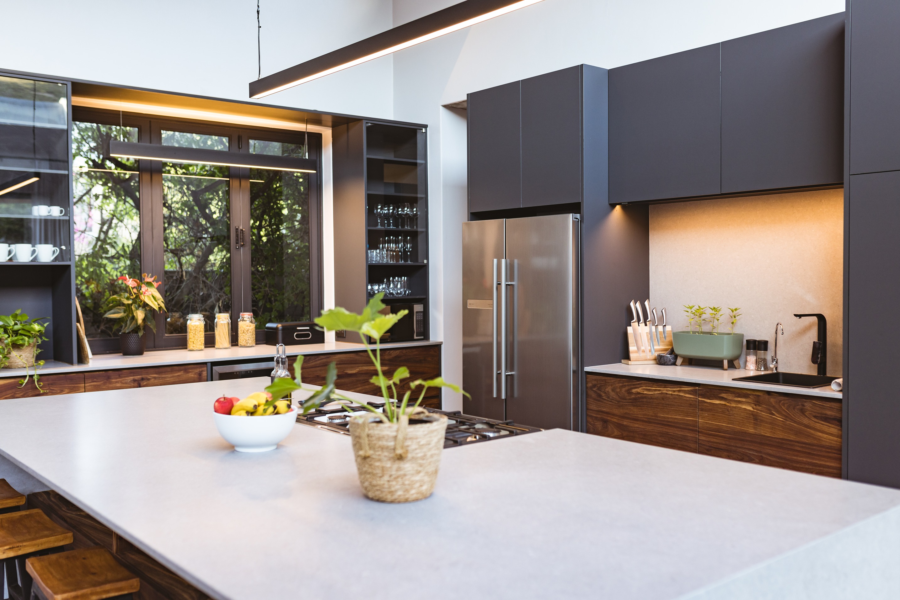 Modern kitchen showing sink, refrigerator, and stove in a kitchen work triangle layout.