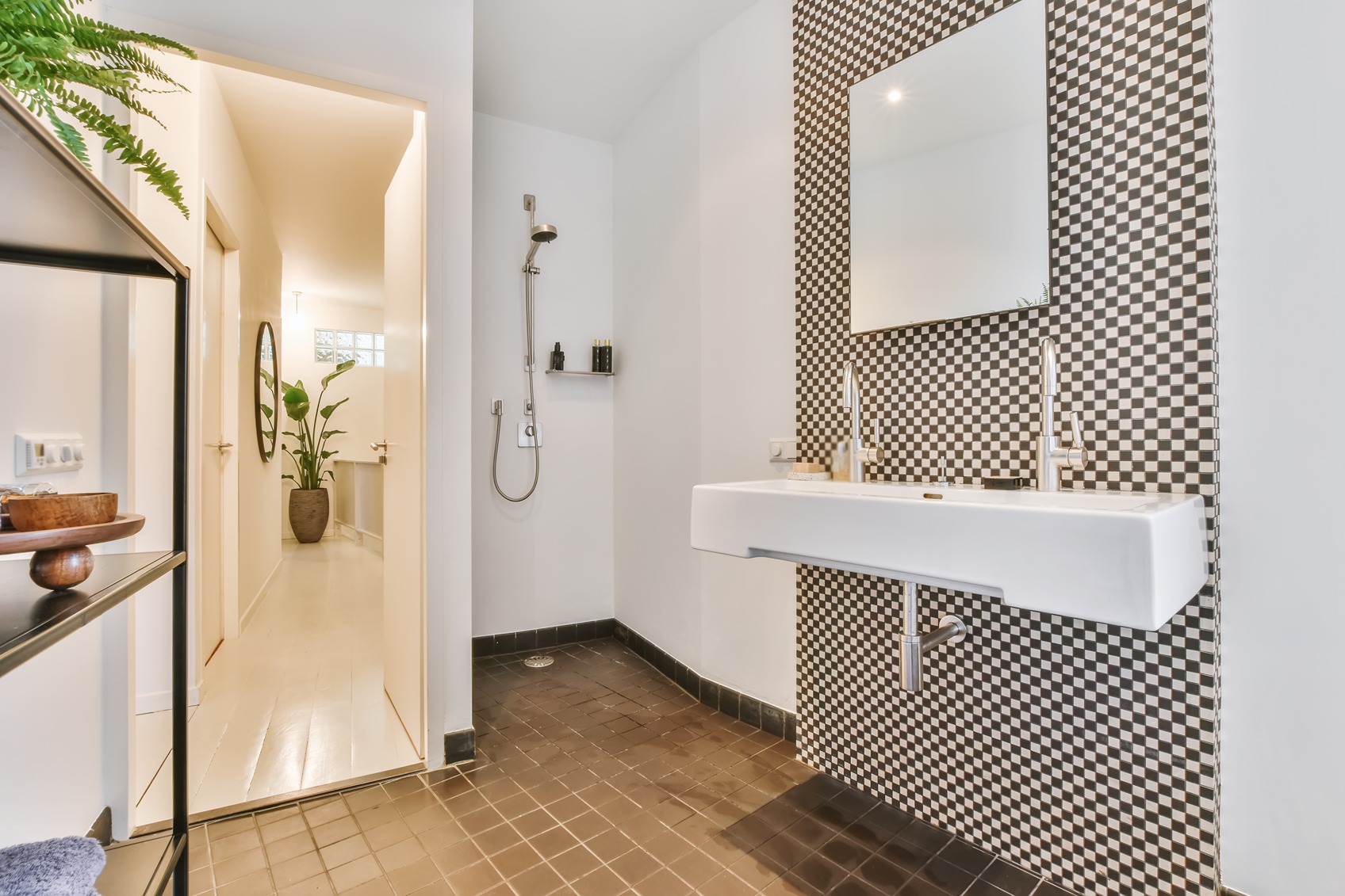 Walk-in shower without doors featuring large format tile and open entry