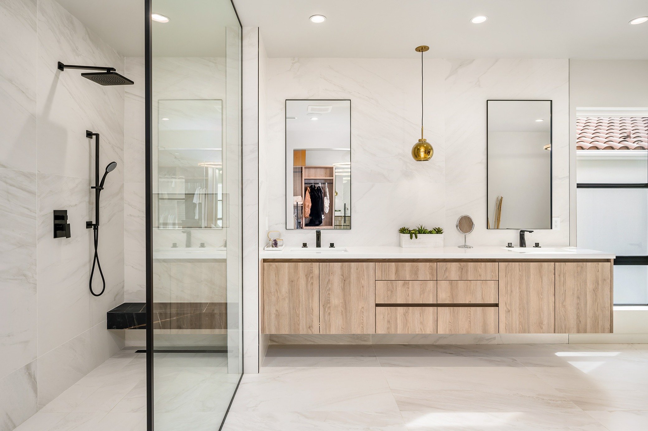 open shower with half wall and large format curbless shower tile  