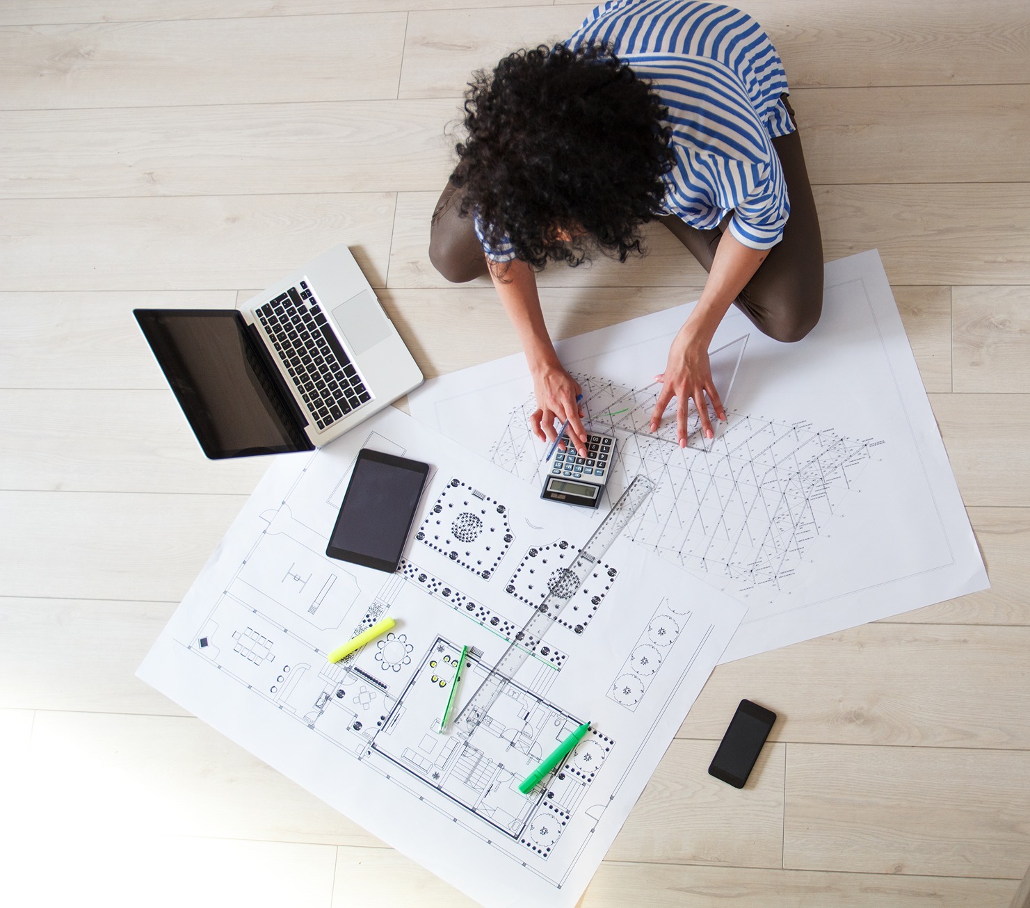 New home construction cost per square foot breakdown on architectural blueprints