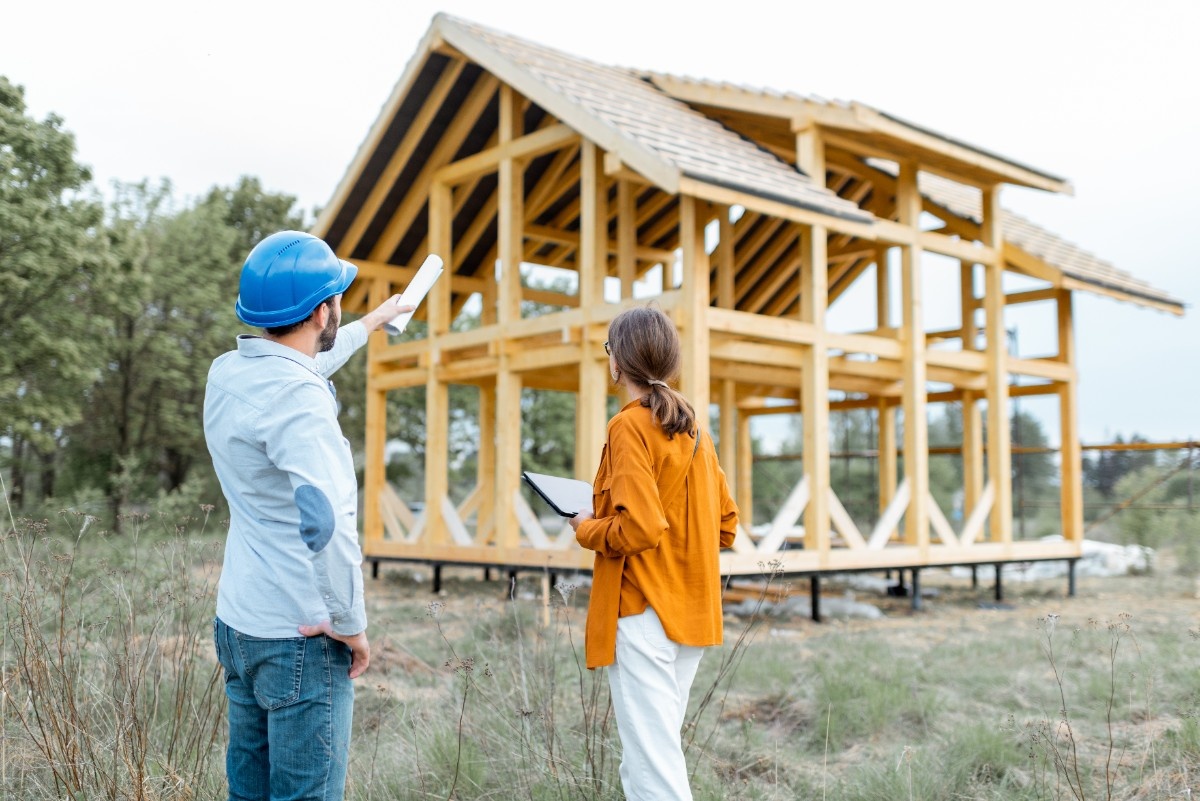Homeowner discussing plans with a builder during detached ADU construction in Snohomish County