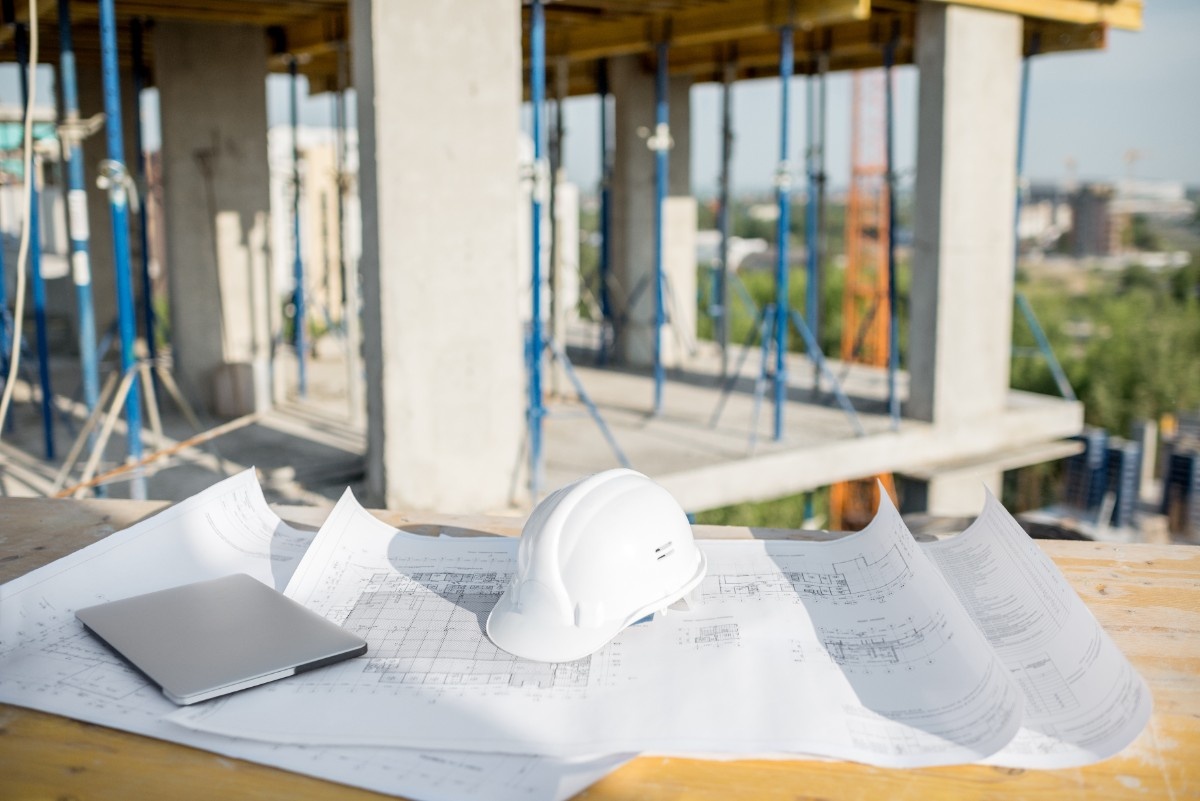 Housing plans laid on a table in a home addition project in Everett