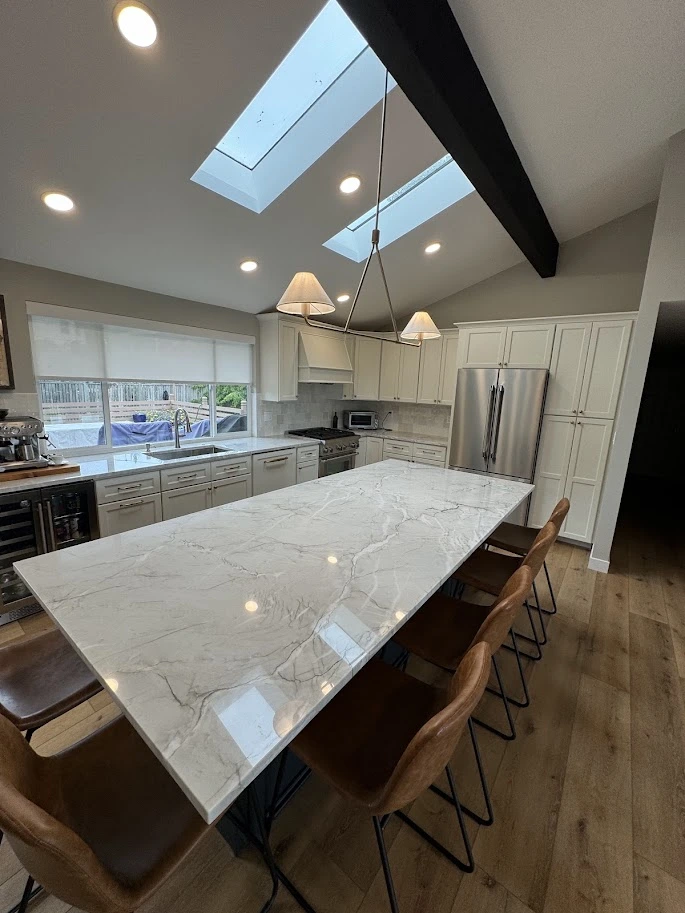 Remodeled kitchen with marble countertop and wood flooring in Mountlake Terrace, WA
