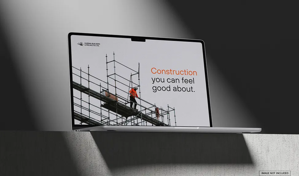 Laptop screen displaying a construction worker on scaffolding with the text 'Construction you can feel good about.'