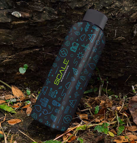 Reusable water bottle with eco-friendly design and Scale branding placed on forest ground.